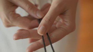 Burning aromatic sticks for meditation while doing yoga. Slow motion