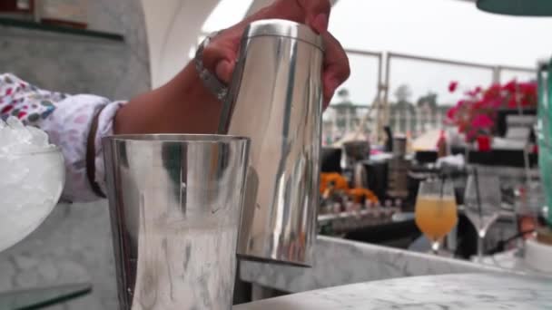 Barman Puts Ice Coctail Shaker Wearing White Summer Shirt Doodles — Vídeo de Stock