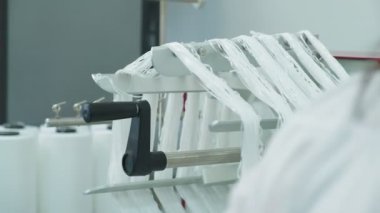 Closeup of polymer thread on the winding wheel, slow motion
