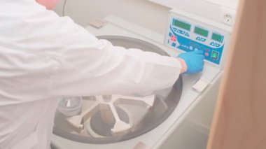 Refrigerated vaccine centrifugation in laboratory, slow motion
