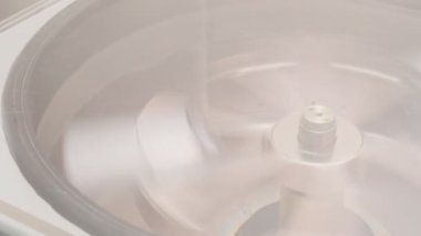 Refrigerated vaccine centrifugation in laboratory, slow motion