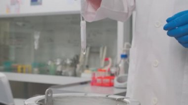 Laboratory samples are taken from a liquid nitrogen fridge, slow motion