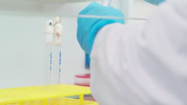 Work on samples of substances is carried out in the laboratory, slow motion