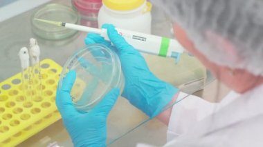 Work on samples of substances is carried out in the laboratory, slow motion
