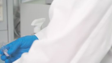 Work on samples of substances is carried out in the laboratory, slow motion