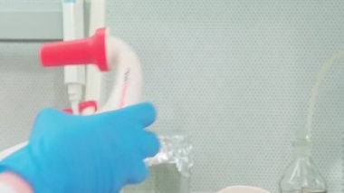 Work on samples of substances is carried out in the laboratory, slow motion