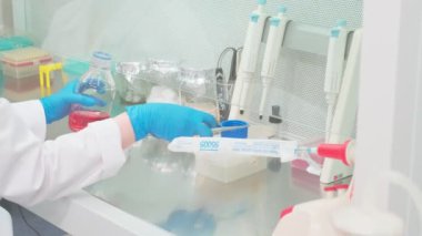 Work on samples of substances is carried out in the laboratory, slow motion