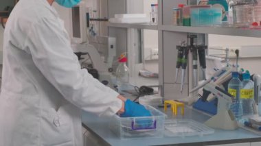 Work on samples of substances is carried out in the laboratory, slow motion
