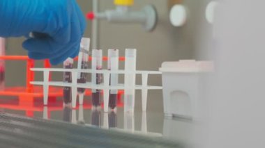 Work on samples of substances is carried out in the laboratory, slow motion