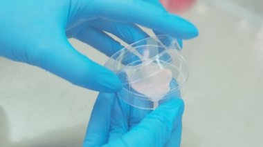 Covid vaccine samples in the round containers, slow motion