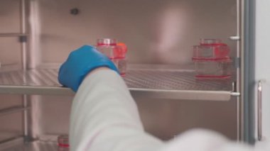 Covid vaccine samples in the round containers, slow motion
