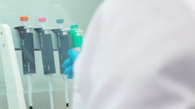 Work on samples of substances is carried out in the laboratory, slow motion