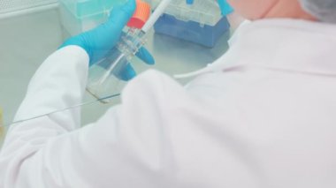Work on samples of substances is carried out in the laboratory, slow motion