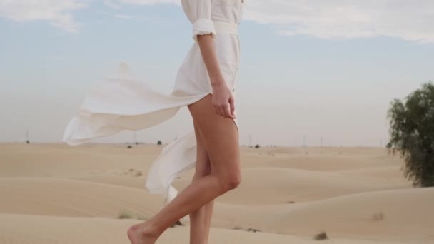 Brunette Barefoot White Dress Fluttering Wind Walks Desert Sand Slow — Wideo stockowe