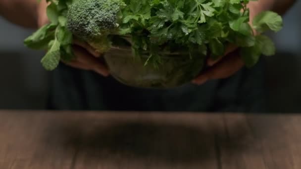 Male Hands Put Bowl Greens Broccoli Cilantro Mint Etc Table — Vídeo de stock