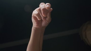 Close-up of a chefs hand salting a dish, slow motion