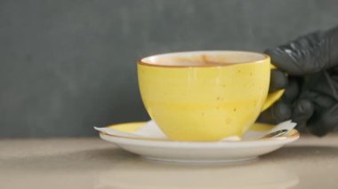 Barista makes coffee on a coffee machine, slow motion close-up.