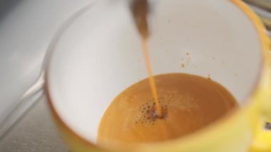 Barista makes coffee on a coffee machine, slow motion close-up.