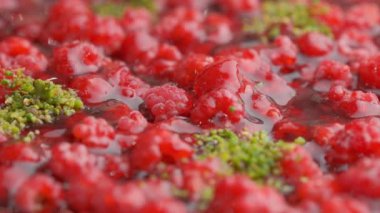 Slow motion close-up shooting of sweet berry and fruit brand desserts