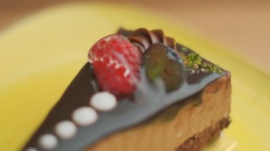 Slow motion close-up shooting of sweet berry and fruit brand desserts