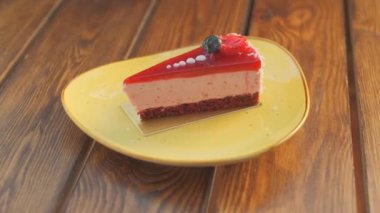Slow motion close-up shooting of sweet berry and fruit brand desserts