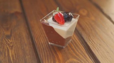 Slow motion close-up shooting of sweet berry and fruit brand desserts