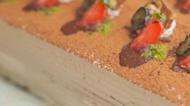 Slow motion close-up shooting of sweet berry and fruit brand desserts