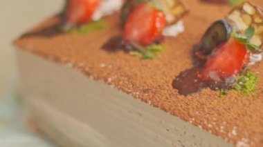 Slow motion close-up shooting of sweet berry and fruit brand desserts