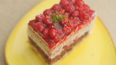 Slow motion close-up shooting of sweet berry and fruit brand desserts