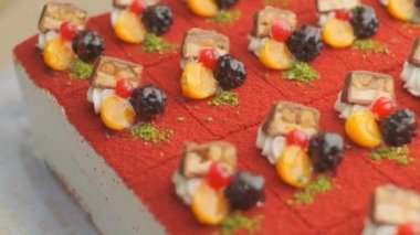 Slow motion close-up shooting of sweet berry and fruit brand desserts