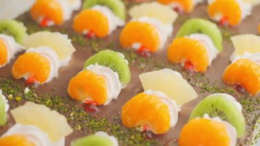 Slow motion close-up shooting of sweet berry and fruit brand desserts