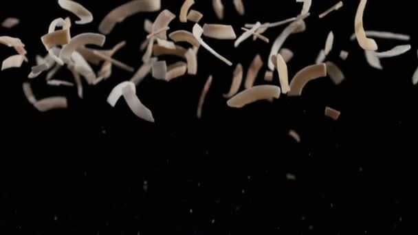 Flying Coconut Chips Black Background Slow Motion — Stock video