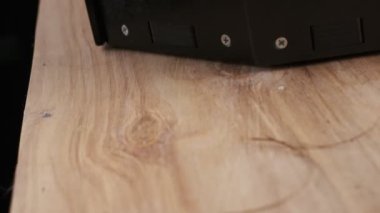 Three coconuts spinning on a black background, slow motion