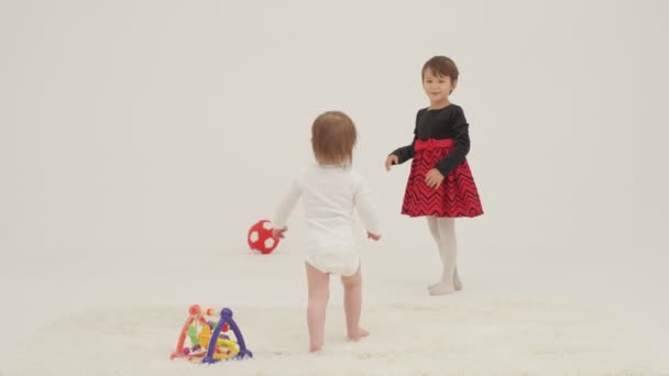 Little Short Hair Girl Plays Toys Little Sister Wearing Diaper — Wideo stockowe
