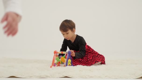 Little Short Hair Girl Plays Toys Little Sister Wearing Diaper — Stockvideo