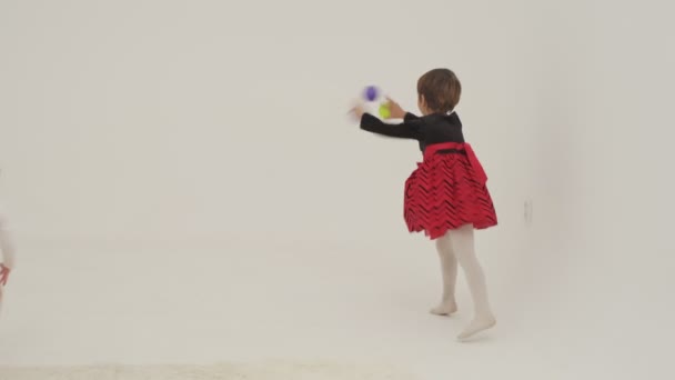 Little Short Hair Girl Plays Toys Little Sister Wearing Diaper — Stock Video