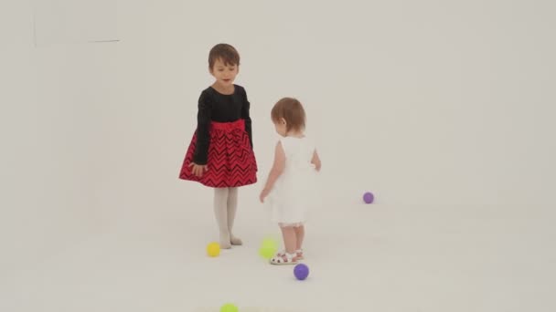 Little Short Hair Girl Plays Toys Little Sister Wearing Diaper — Stock video