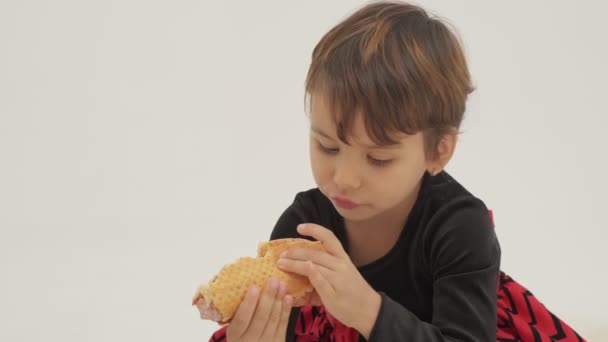 Short Haired Little Girl Eats Hot Dog Slow Motion — Video