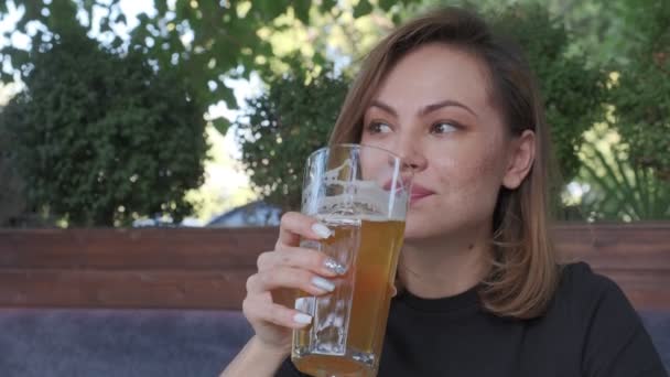 Closeup Woman Wearing Black Drinking Light Beer Big Glass Filmed — Vídeos de Stock