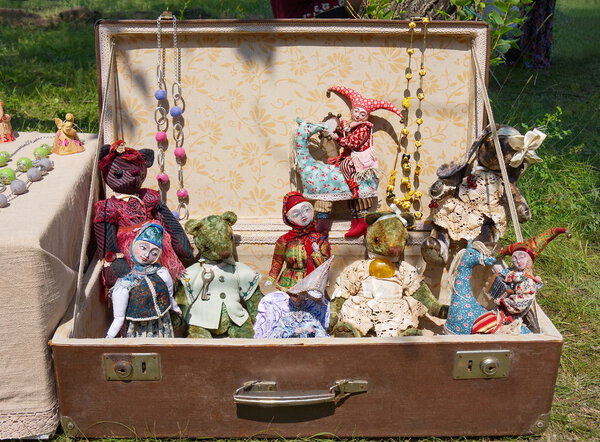 Antique dolls in the suitcase.