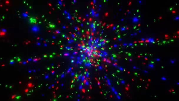 VJ hurok mozgás kis háromszög alakú piros, kék, zöld és sárga részecskék pulzáló sugarak a központból — Stock videók