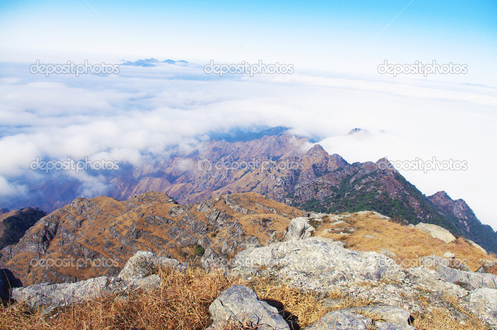 Clouds around the top of high mountain