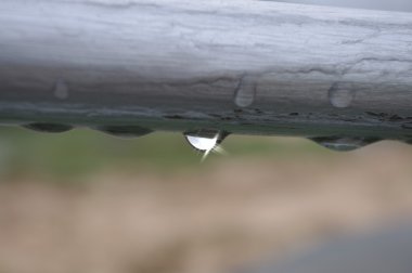 Water-drop under the waterpipe clipart