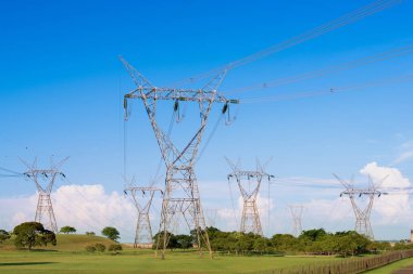 Electric power lines coming out from a Itaipu dam, Parana State, Brazil clipart