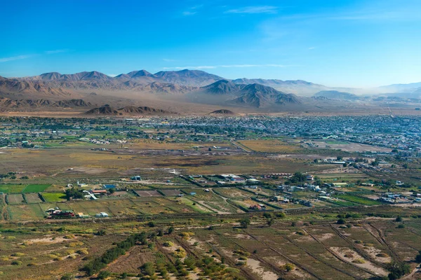 Aerial view of the mining city of Calama in northern Chile with Chuquicamata copper mine in the back.
