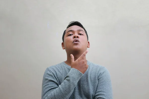 Asian Man Wearing Sweater Posing Holding His Chin Looking Very — Zdjęcie stockowe