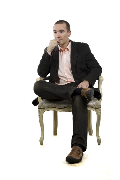 Man sitting in a chair (white background) — Stock Photo, Image