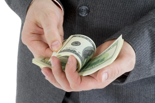 Empilhar notas de 100 dólares em mãos masculinas — Fotografia de Stock