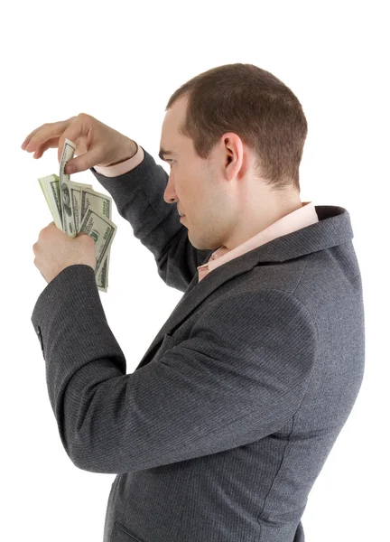 Man pulls out a banknote out of the pack — Stock Photo, Image