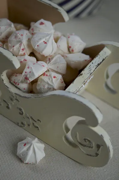 Meringues with peppermint candy crashes for Christmas dessert Stock Image